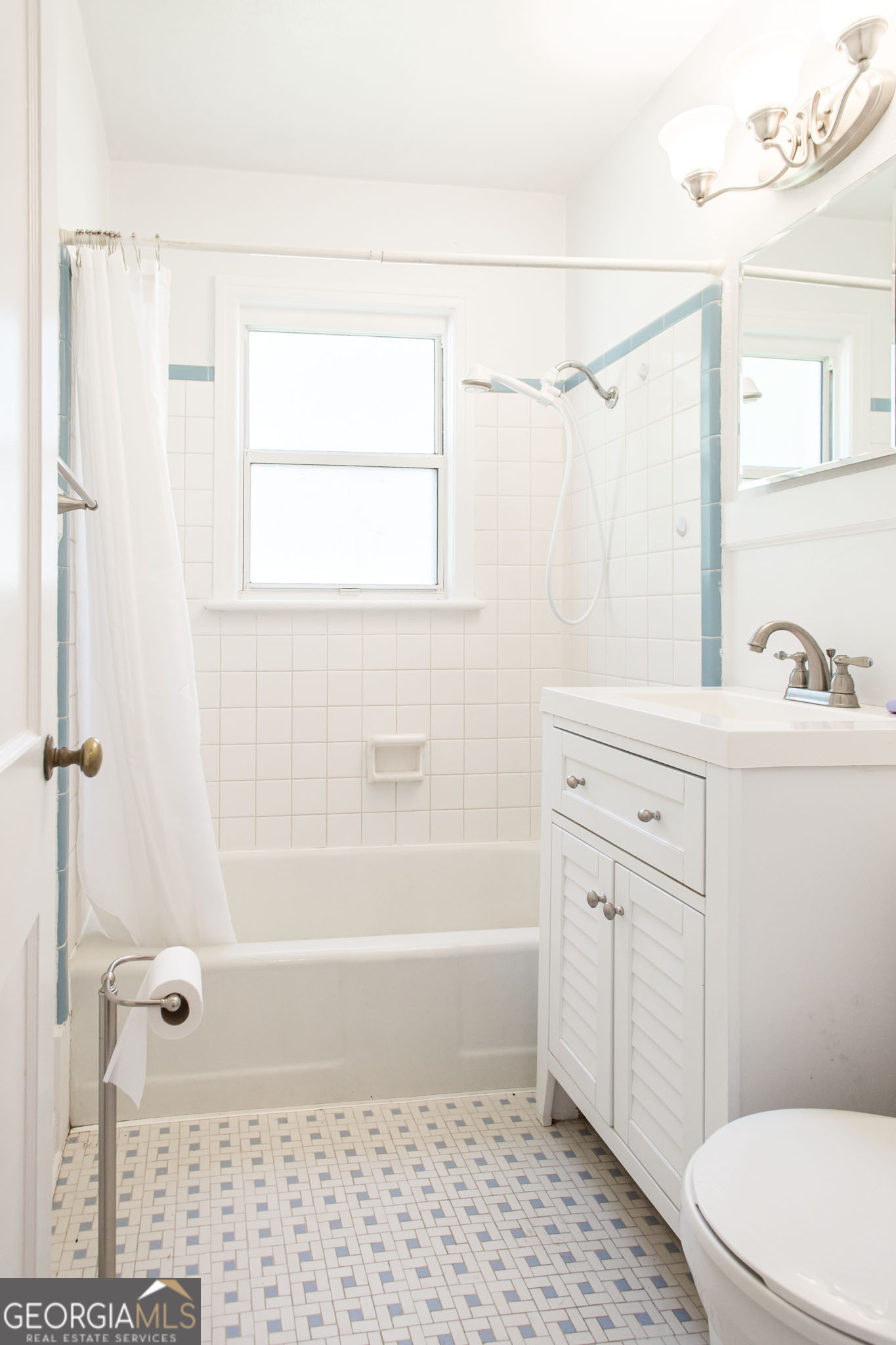 1009 Euclid Avenue Waycross, GA 31501 - Photo 18 of 35 a bathroom with a sink a toilet a window and shower
