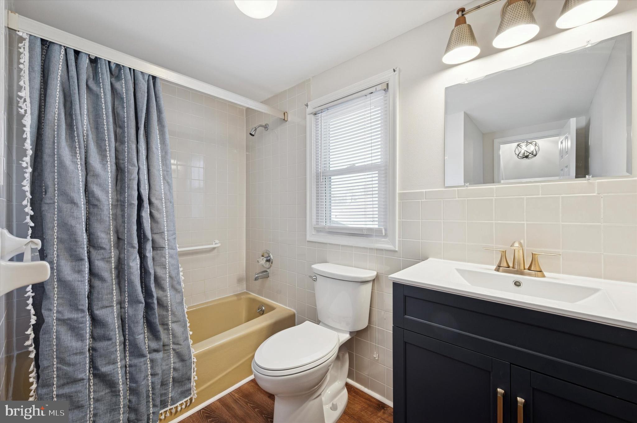 421 Lawrence Road Havertown, PA 19083 - Photo 15 of 25 a bathroom with a sink toilet a mirror and shower