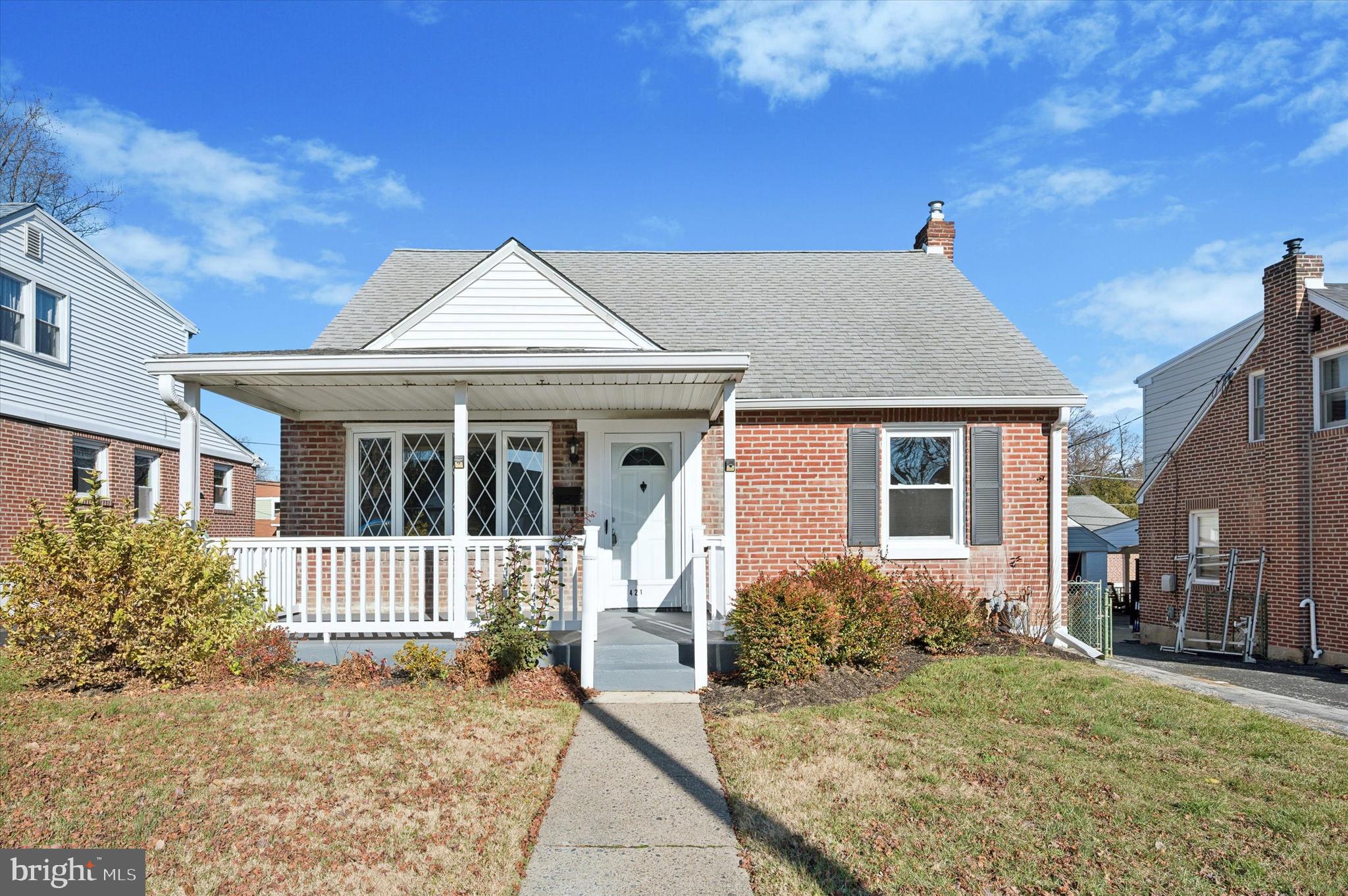 421 Lawrence Road Havertown, PA 19083 - Photo 2 of 25 a front view of a house with a porch
