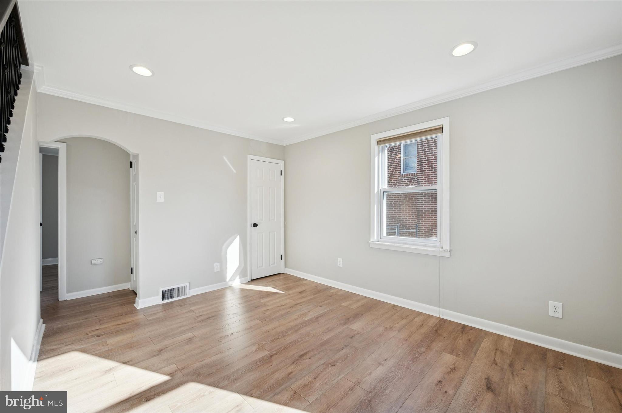 421 Lawrence Road Havertown, PA 19083 - Photo 7 of 25 wooden floor in an empty room with a window