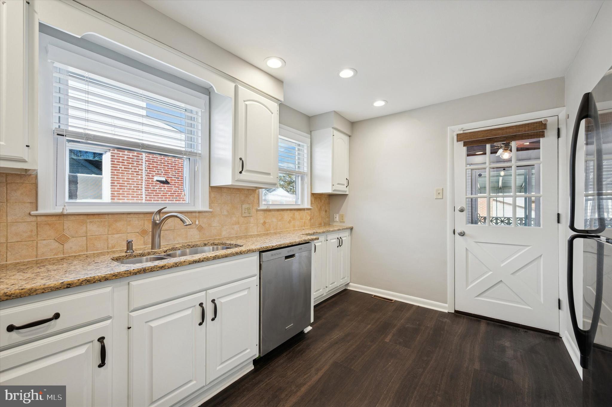 421 Lawrence Road Havertown, PA 19083 - Photo 10 of 25 a spacious bathroom with double vanity and a mirror