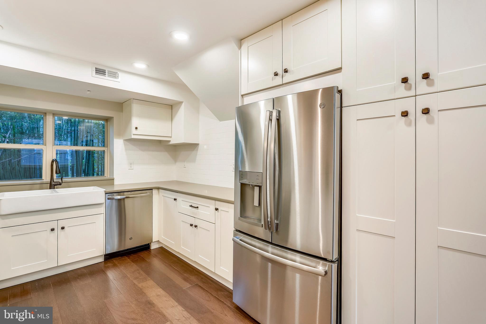 6 Circle Circle Washington Grove, MD 20880 - Photo 12 of 45 a kitchen with white cabinets and stainless steel appliances