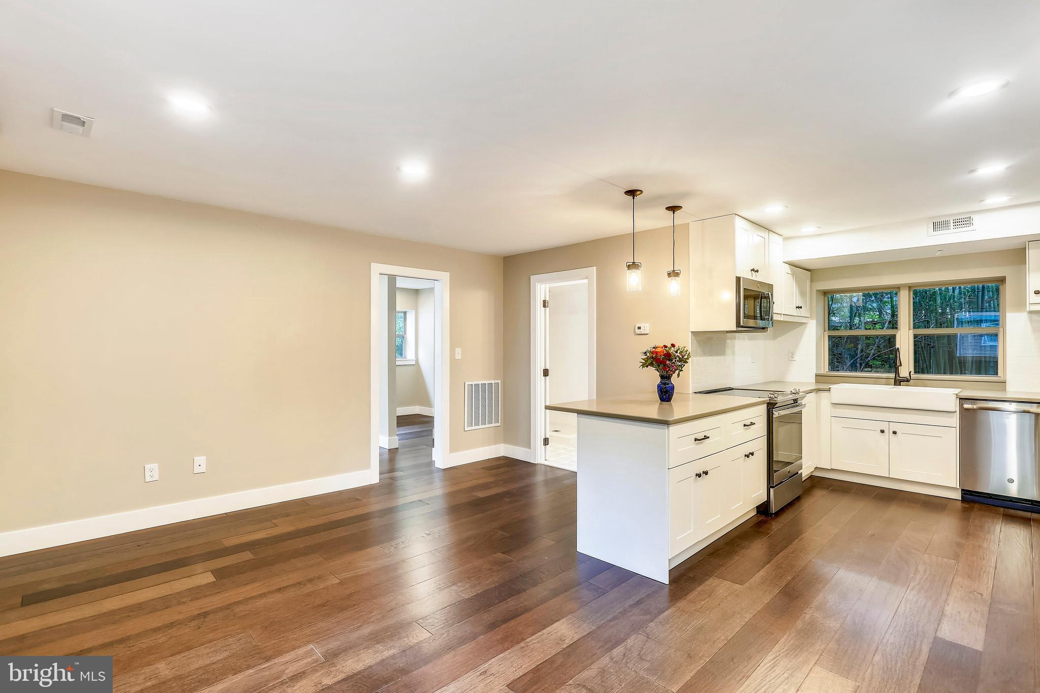 6 Circle Circle Washington Grove, MD 20880 - Photo 15 of 45 a large white room with kitchen island