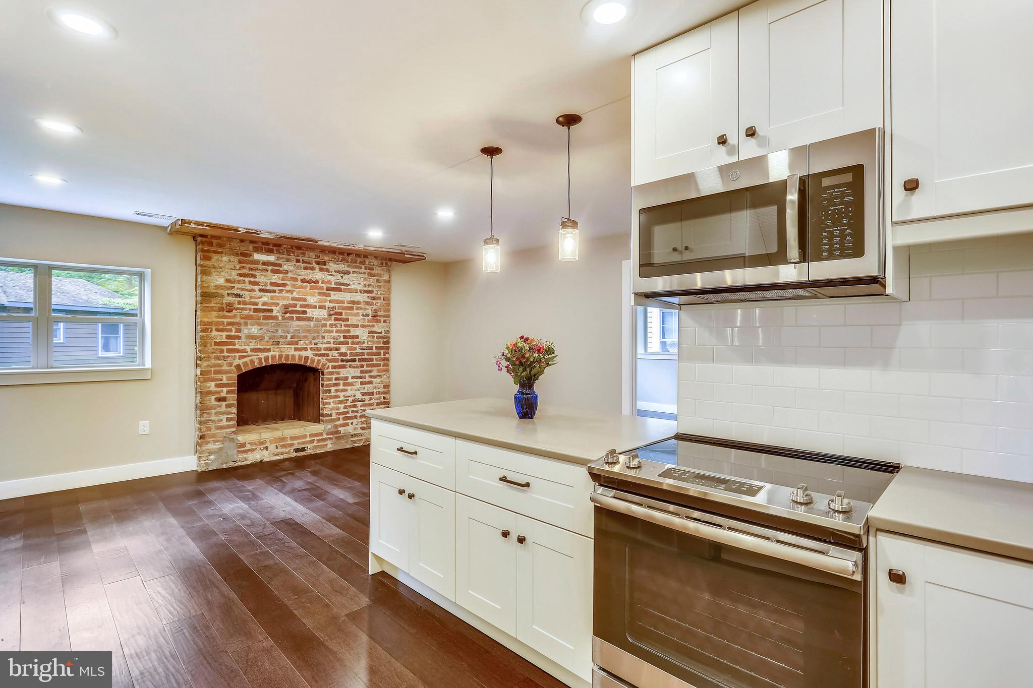 6 Circle Circle Washington Grove, MD 20880 - Photo 16 of 45 a kitchen with stainless steel appliances a stove microwave and cabinets