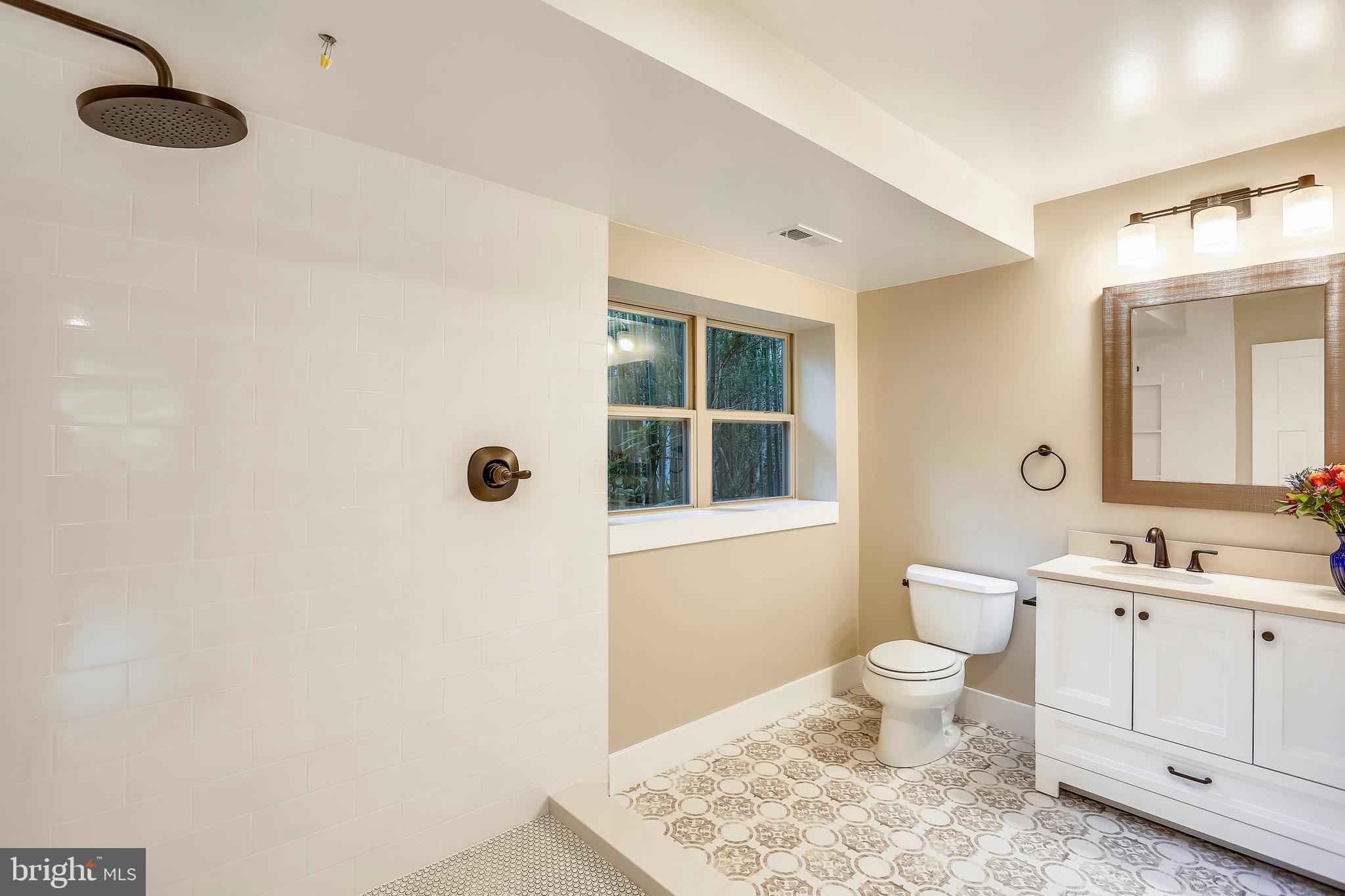 6 Circle Circle Washington Grove, MD 20880 - Photo 21 of 45 a bathroom with a toilet sink and mirror