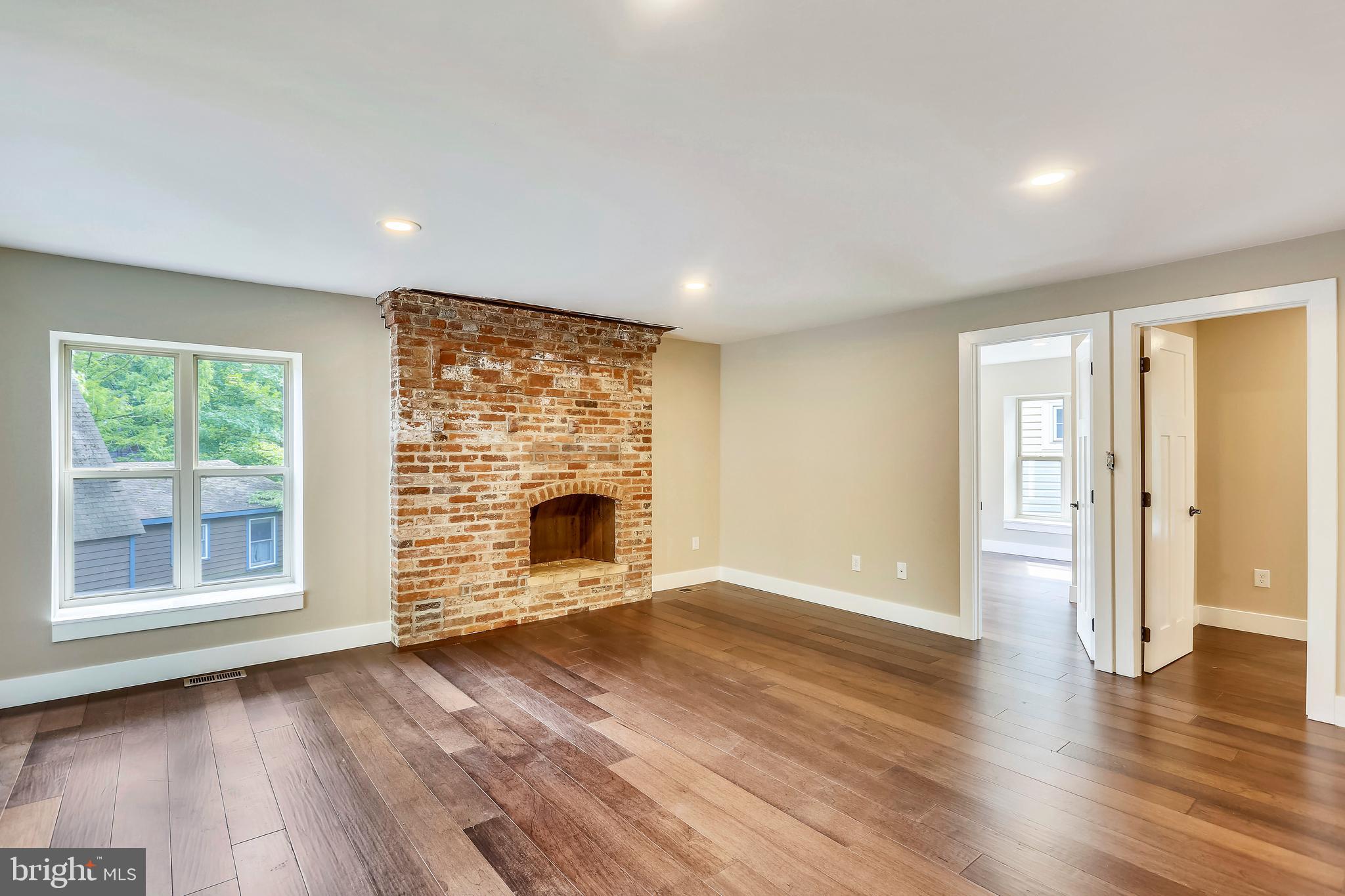 6 Circle Circle Washington Grove, MD 20880 - Photo 30 of 45 a view of an empty room with a window and wooden floor