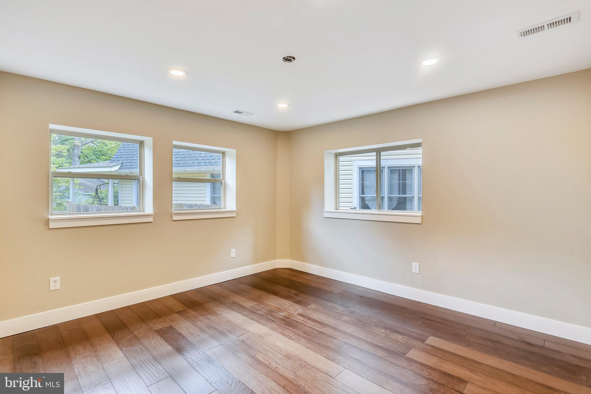 6 Circle Circle Washington Grove, MD 20880 - Photo 32 of 45 a view of empty room with wooden floor and fan