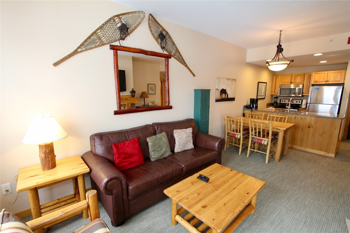172 Copper Circle, Unit 301 Copper Mountain, CO 80443 - Photo 11 of 23 a living room with furniture a rug and a chandelier