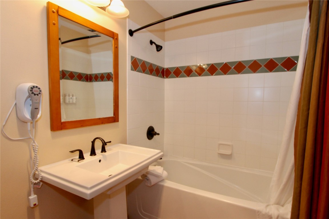 172 Copper Circle, Unit 301 Copper Mountain, CO 80443 - Photo 16 of 23 a bathroom with a sink and a bathtub