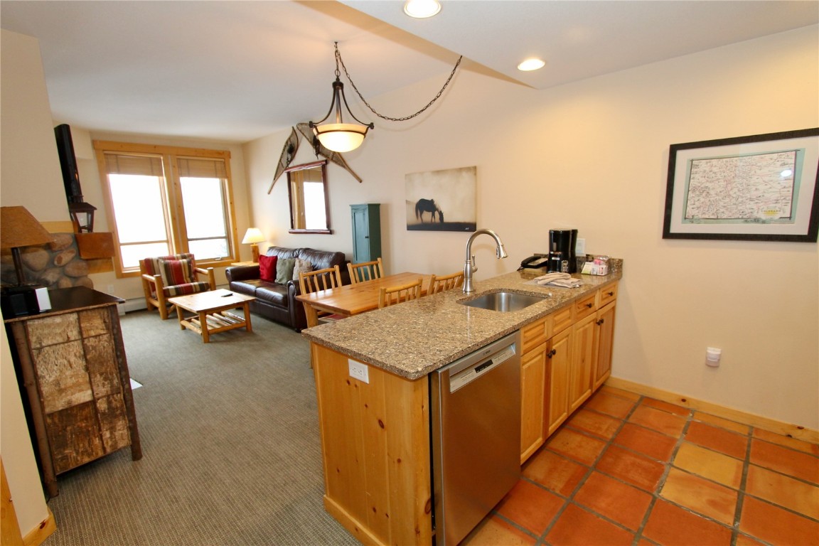 172 Copper Circle, Unit 301 Copper Mountain, CO 80443 - Photo 5 of 23 a kitchen with a sink and a stove top oven