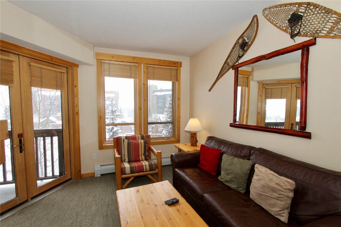 172 Copper Circle, Unit 301 Copper Mountain, CO 80443 - Photo 9 of 23 a living room with furniture and a large window