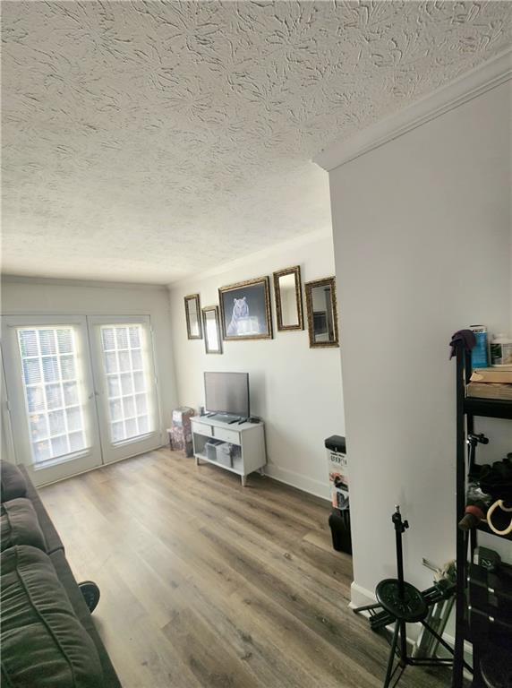 1279 Ridgecrest Lane Southeast Smyrna, GA 30080 - Photo 11 of 15 a living room with furniture and wooden floor