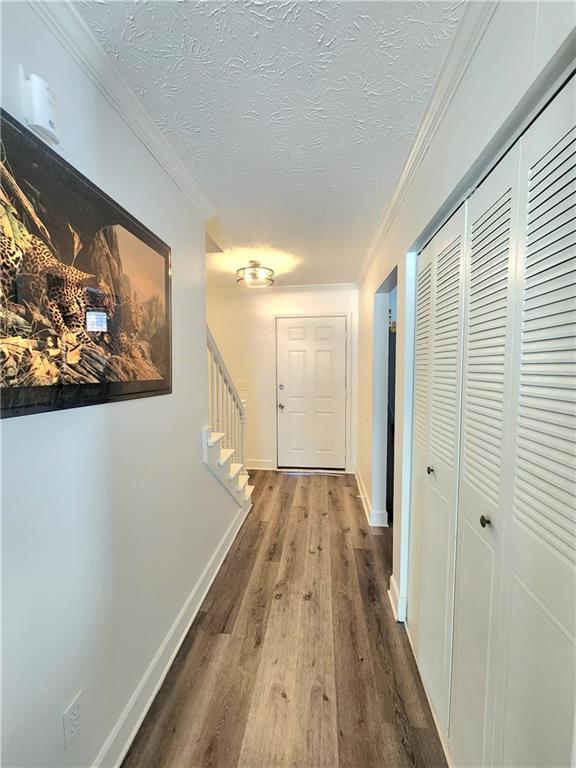 1279 Ridgecrest Lane Southeast Smyrna, GA 30080 - Photo 9 of 15 a view of a hallway with wooden floor and a bathroom