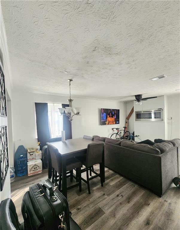 1279 Ridgecrest Lane Southeast Smyrna, GA 30080 - Photo 10 of 15 a living room with furniture and a dining table