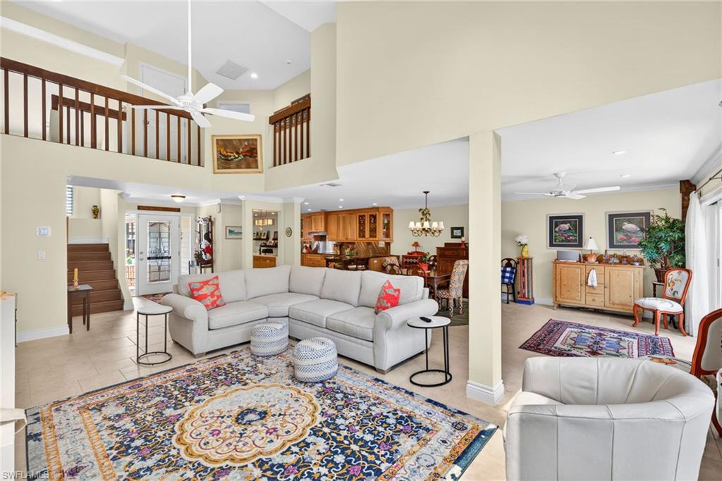 4030 Crayton Road, Unit C2 Naples, FL 34103 - Photo 19 of 32 a living room with furniture and a rug
