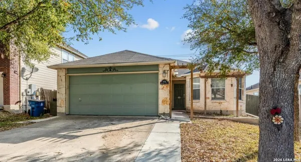a front view of a house with a garage