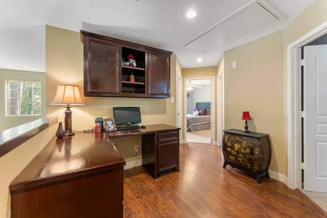 a kitchen with a refrigerator and a stove top oven