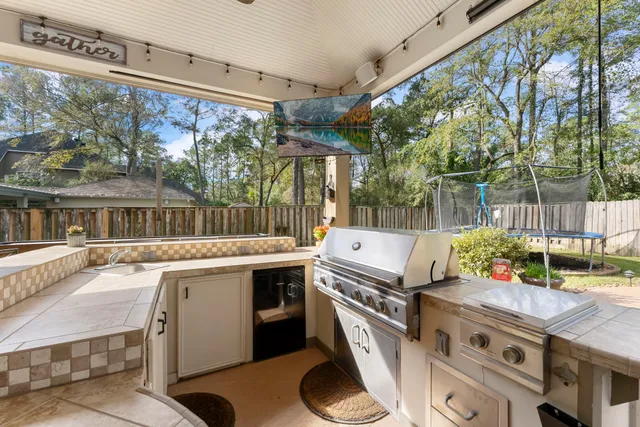 a kitchen with a stove and a sink