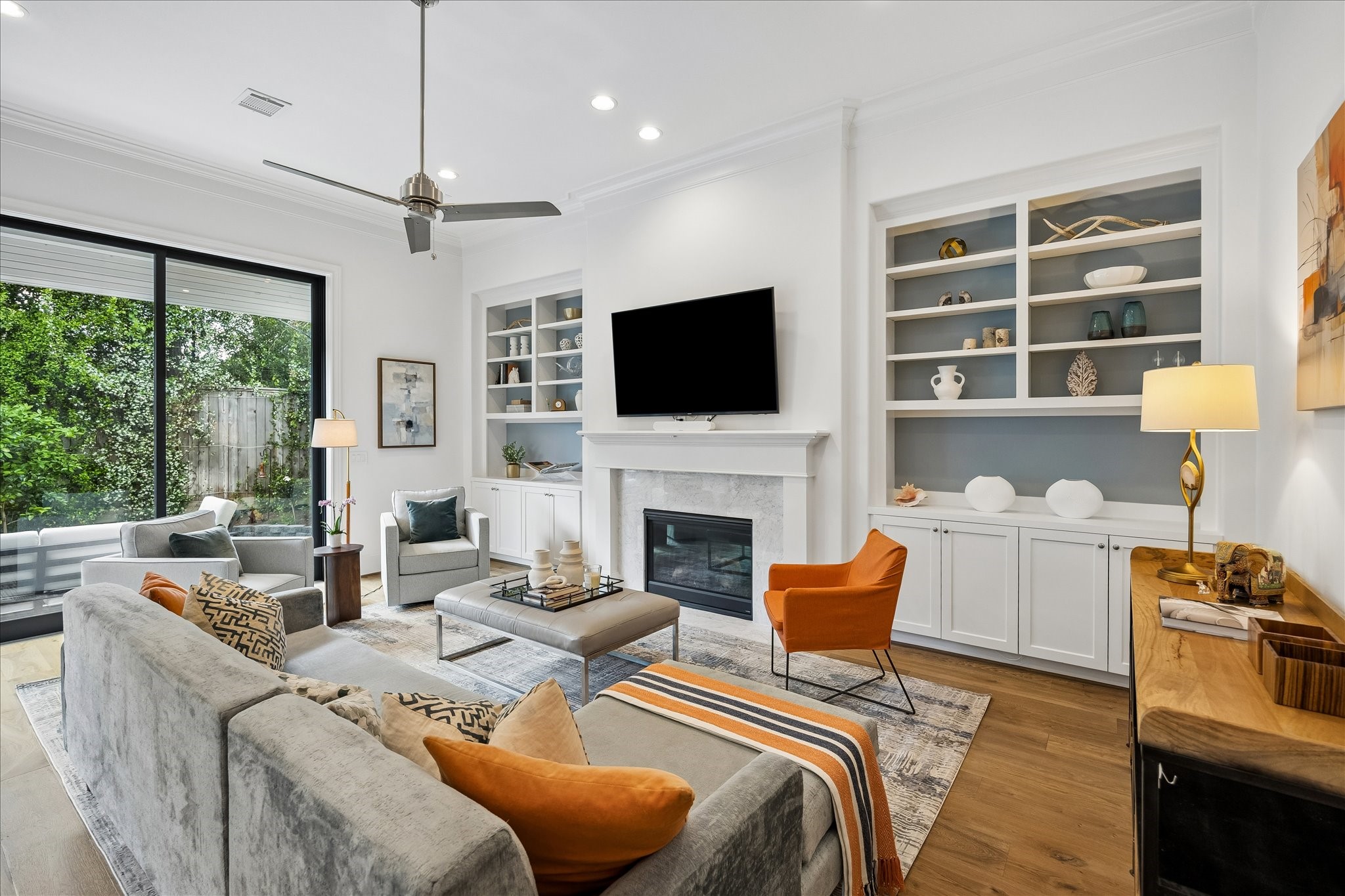3020 Lake Street Houston, TX 77098 - Photo 5 of 41 Built-in bookcases and storage flank the fireplace.