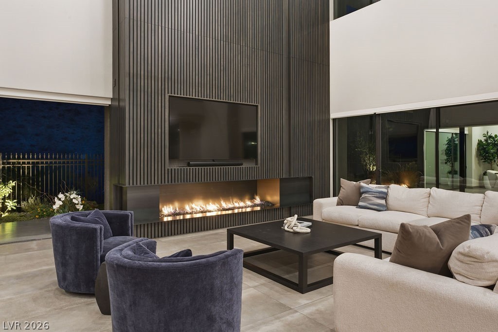 1456 Solitude Ridge Drive Henderson, NV 89012 - Photo 4 of 94 Family Room with Maple-Clad Wall & Fire Feature