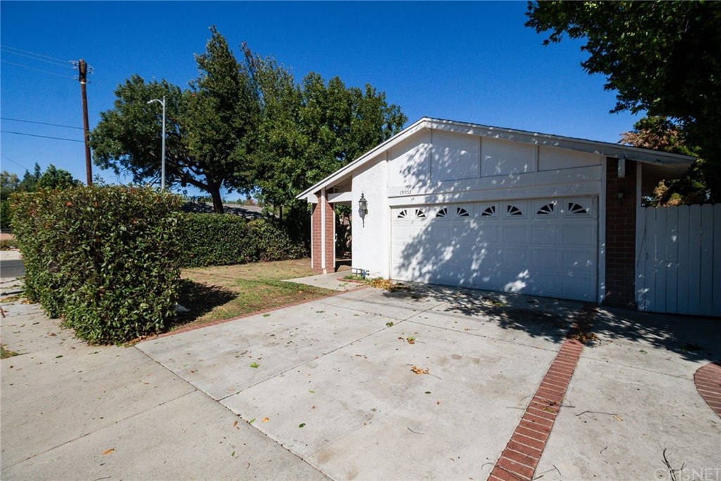 19955 Community Street Winnetka, CA 91306 - Photo 1 of 1 a view of a house with a yard