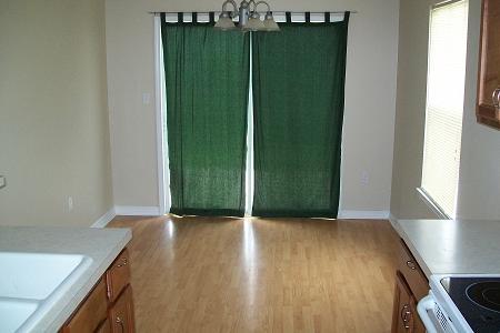 295 Limestone Circle Crestview, FL 32539 - Photo 6 of 11 a view of an empty room with wooden floor and a window