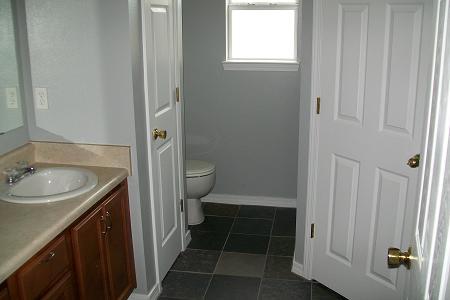 295 Limestone Circle Crestview, FL 32539 - Photo 8 of 11 a bathroom with a sink toilet and shower