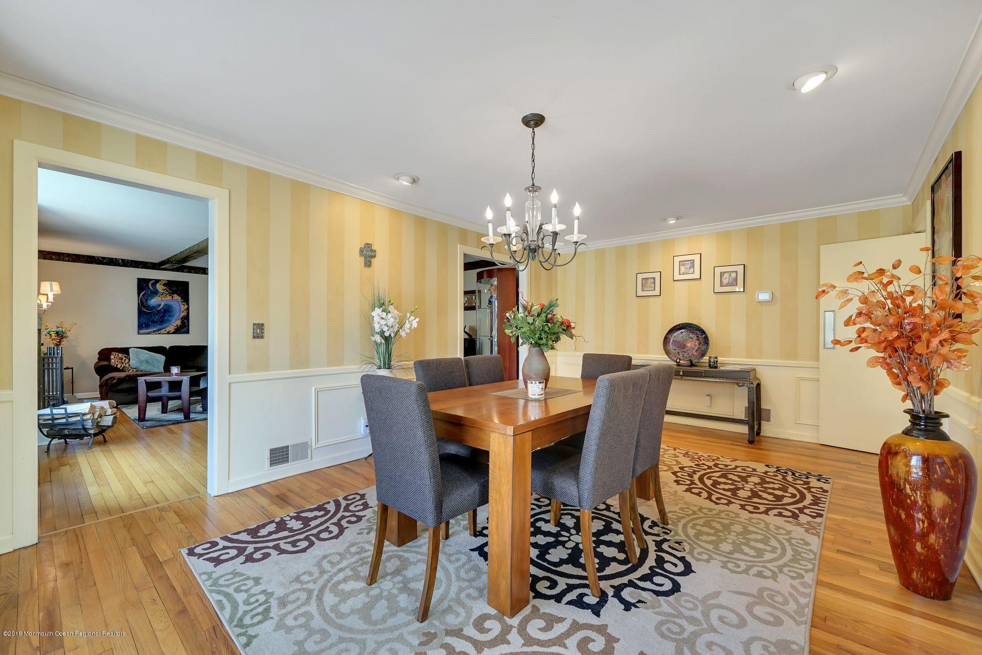 11 Heathcliff Road Rumson, NJ 07760 - Photo 12 of 31 a view of a dining room with furniture a chandelier and wooden floor