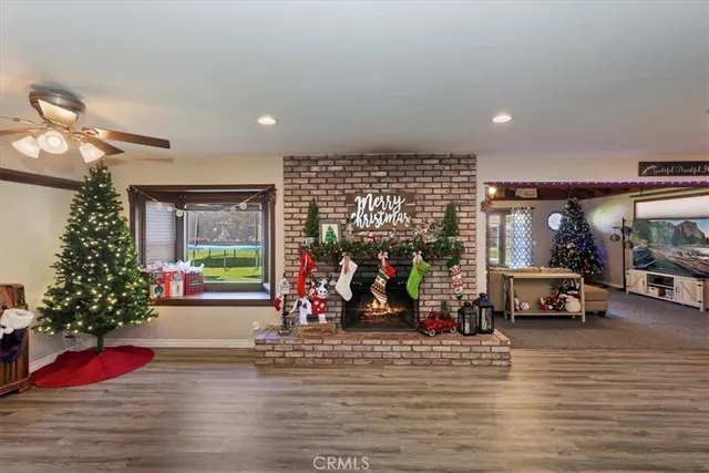 a kitchen with stainless steel appliances a stove and wooden floor