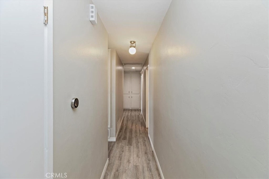 1441 Fifth Street Norco, CA 92860 - Photo 32 of 72 a view of a hallway with wooden floor