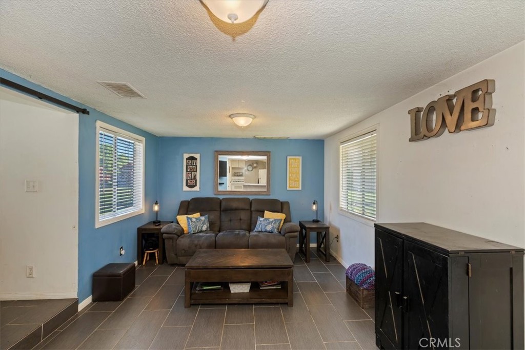 1441 Fifth Street Norco, CA 92860 - Photo 33 of 72 a living room with furniture and a window