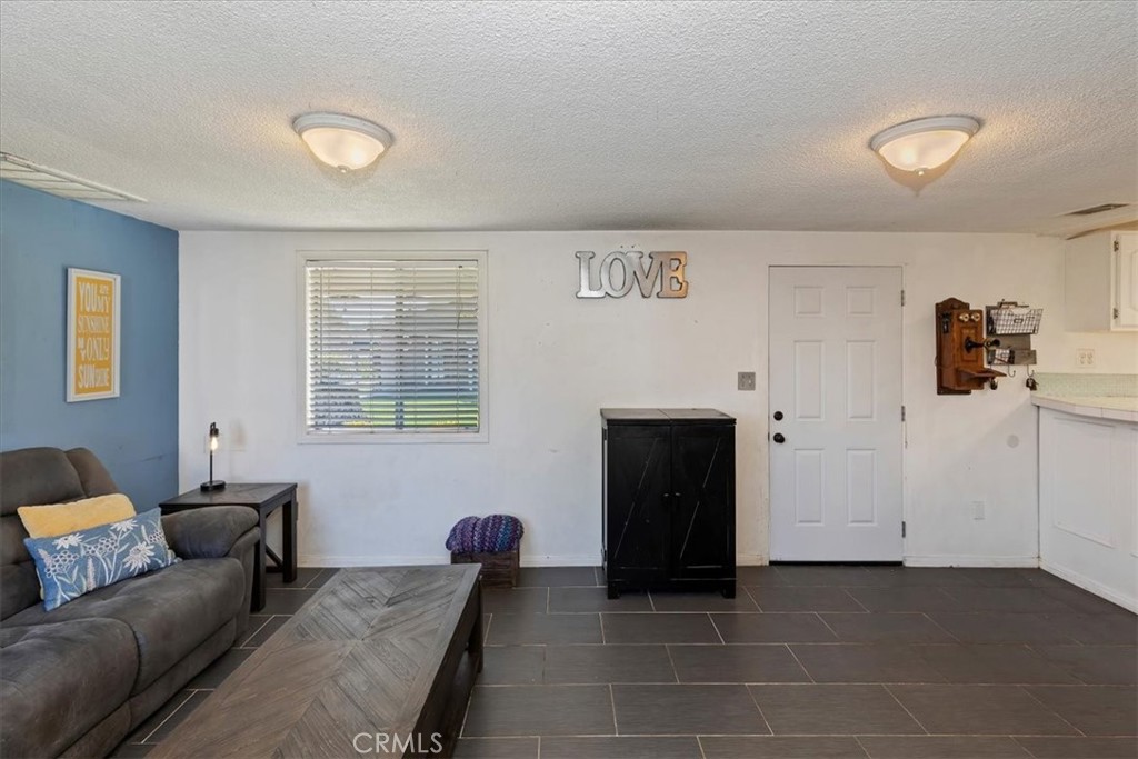 1441 Fifth Street Norco, CA 92860 - Photo 34 of 72 a living room with furniture and a window