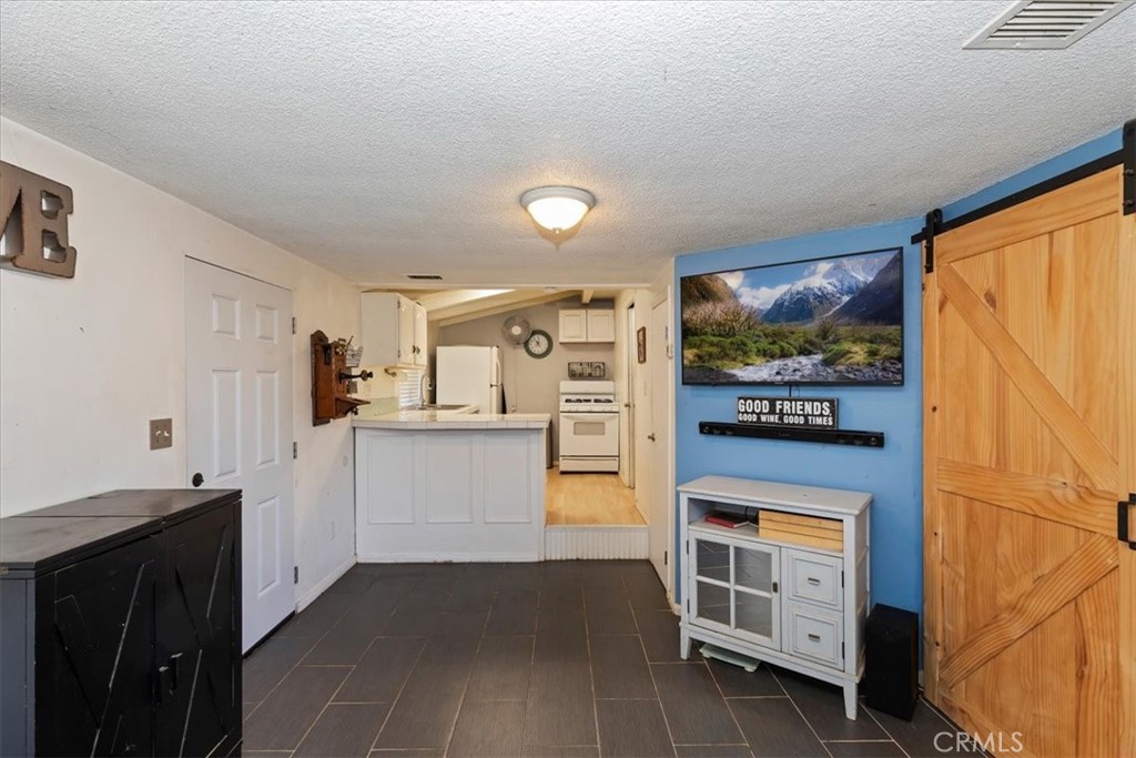1441 Fifth Street Norco, CA 92860 - Photo 35 of 72 a kitchen with a refrigerator and a stove
