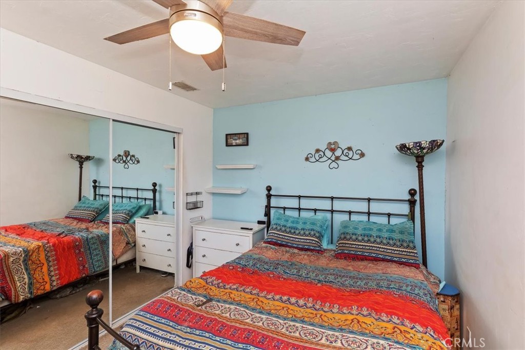 1441 Fifth Street Norco, CA 92860 - Photo 38 of 72 a bedroom with bed and a chandelier