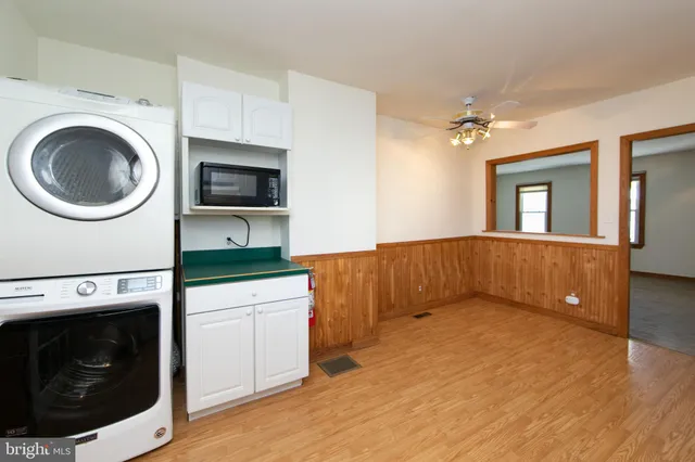 a view of a kitchen with washer and dryer