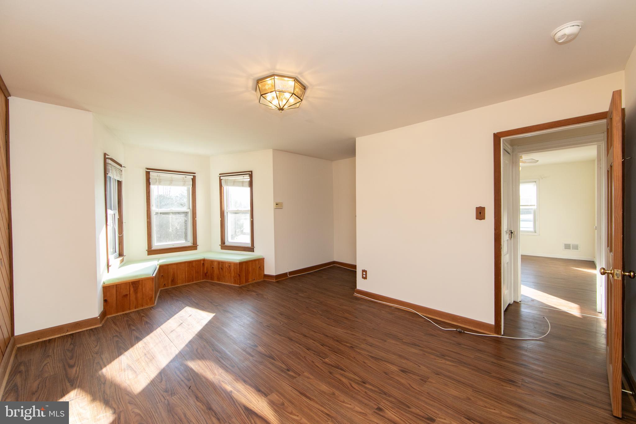 1005 Atsion Road Shamong, NJ 08088 - Photo 17 of 42 an empty room with wooden floor and windows