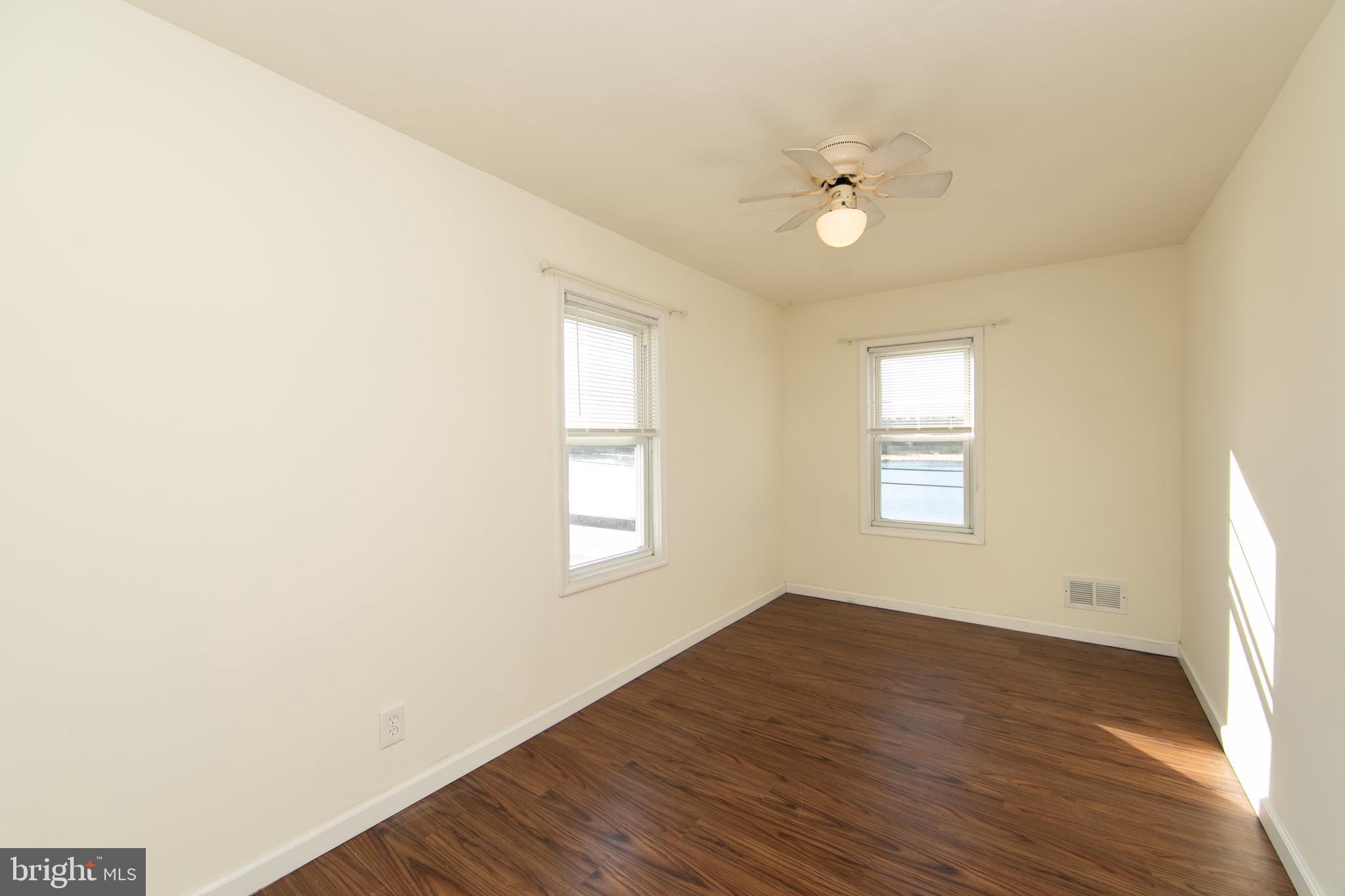 1005 Atsion Road Shamong, NJ 08088 - Photo 25 of 42 a view of an empty room with a window and wooden floor