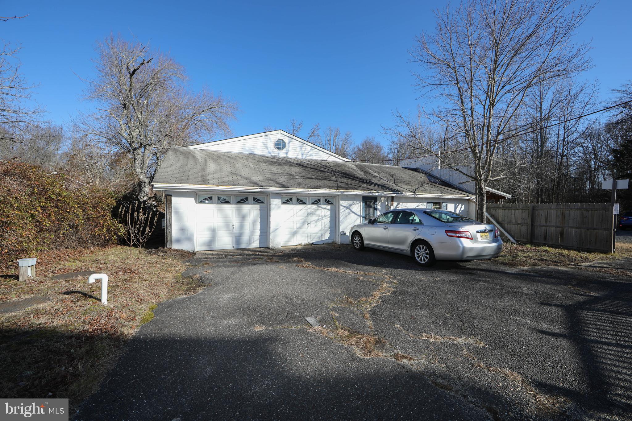 1005 Atsion Road Shamong, NJ 08088 - Photo 40 of 42 a car parked on the side of the road