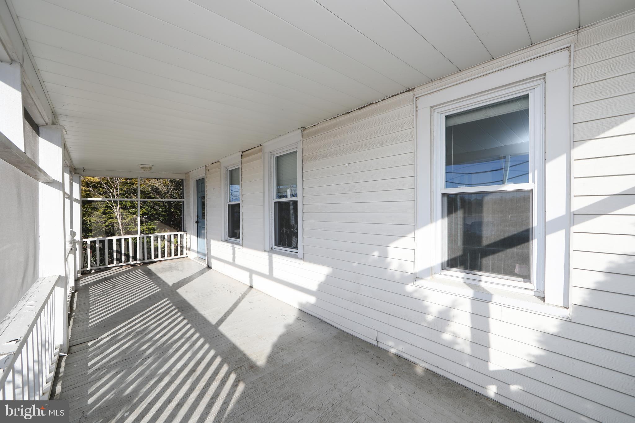 1005 Atsion Road Shamong, NJ 08088 - Photo 5 of 42 a balcony with white floor and wooden floor