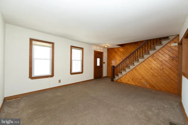 a view of an empty room with windows