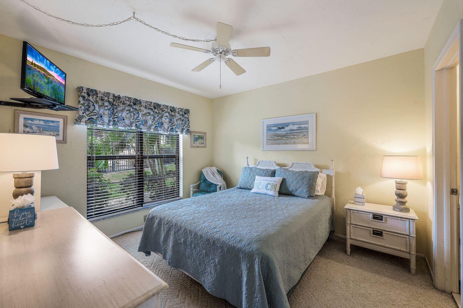 780 San Marco Road, Unit 104 Marco Island, FL 34145 - Photo 12 of 25 a bedroom with a bed and a flat tv screen