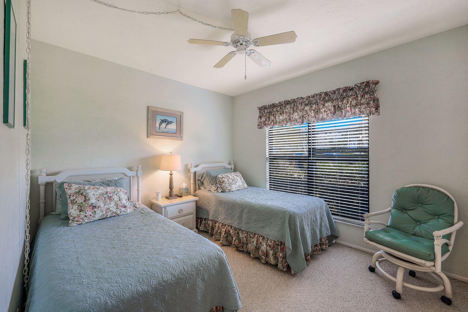 780 San Marco Road, Unit 104 Marco Island, FL 34145 - Photo 14 of 25 a bedroom with two beds and a window