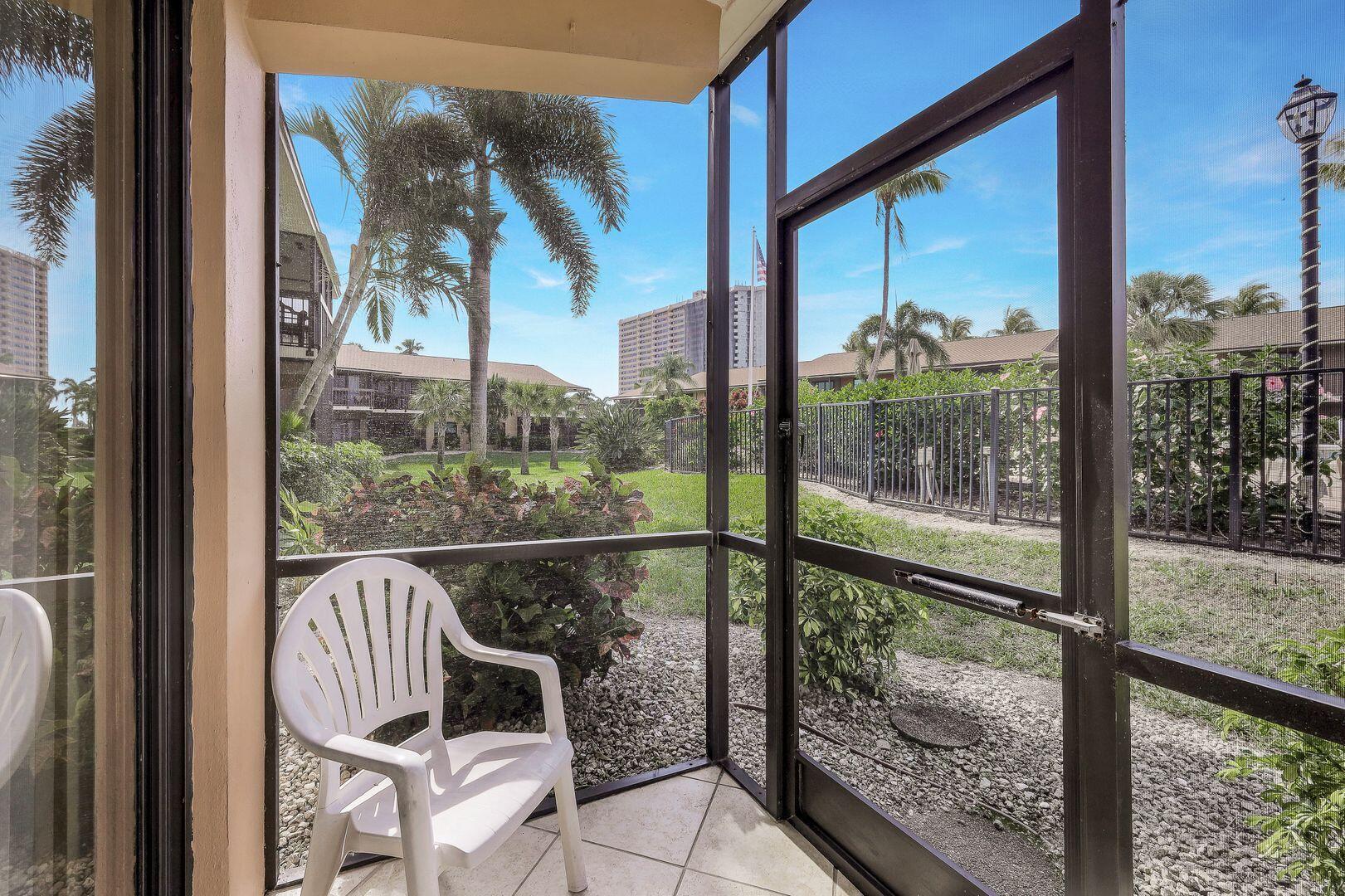 780 San Marco Road, Unit 104 Marco Island, FL 34145 - Photo 18 of 25 a view of a balcony with chairs