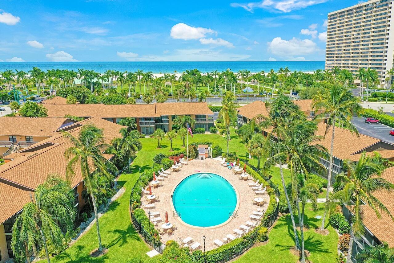 780 San Marco Road, Unit 104 Marco Island, FL 34145 - Photo 21 of 25 view of a swimming pool with an outdoor space and seating area