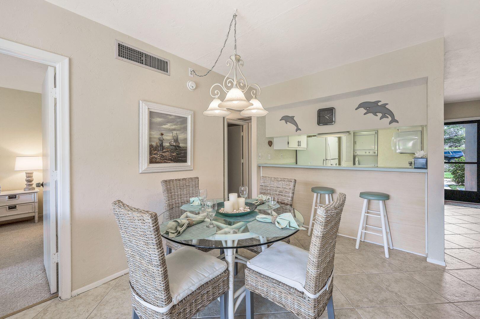 780 San Marco Road, Unit 104 Marco Island, FL 34145 - Photo 7 of 25 a dining room with furniture and window