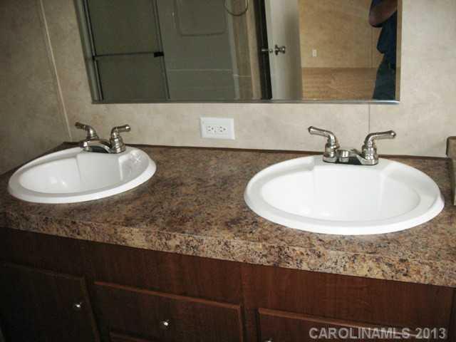 1638 Old Pinckney Road York, SC 29745 - Photo 12 of 16 a bathroom with a sink and a mirror
