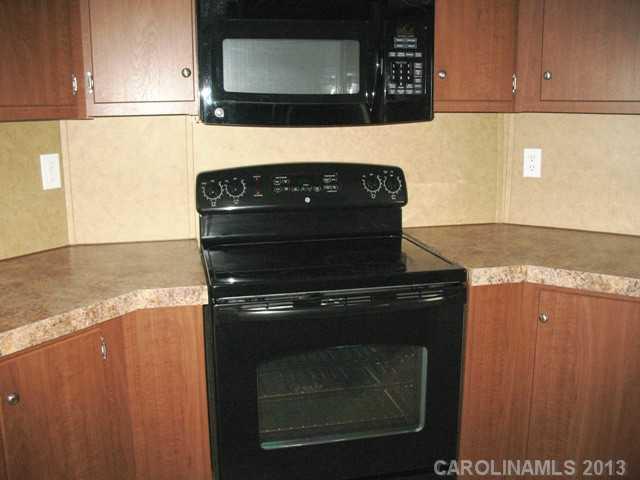 1638 Old Pinckney Road York, SC 29745 - Photo 14 of 16 a stove top oven sitting inside of a kitchen