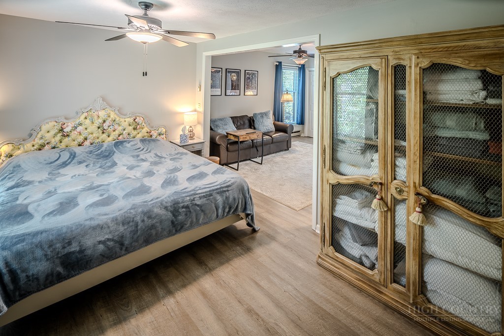 38 Rocky Meadows Road Newland, NC 28657 - Photo 20 of 50 a bedroom with a bed and a chandelier