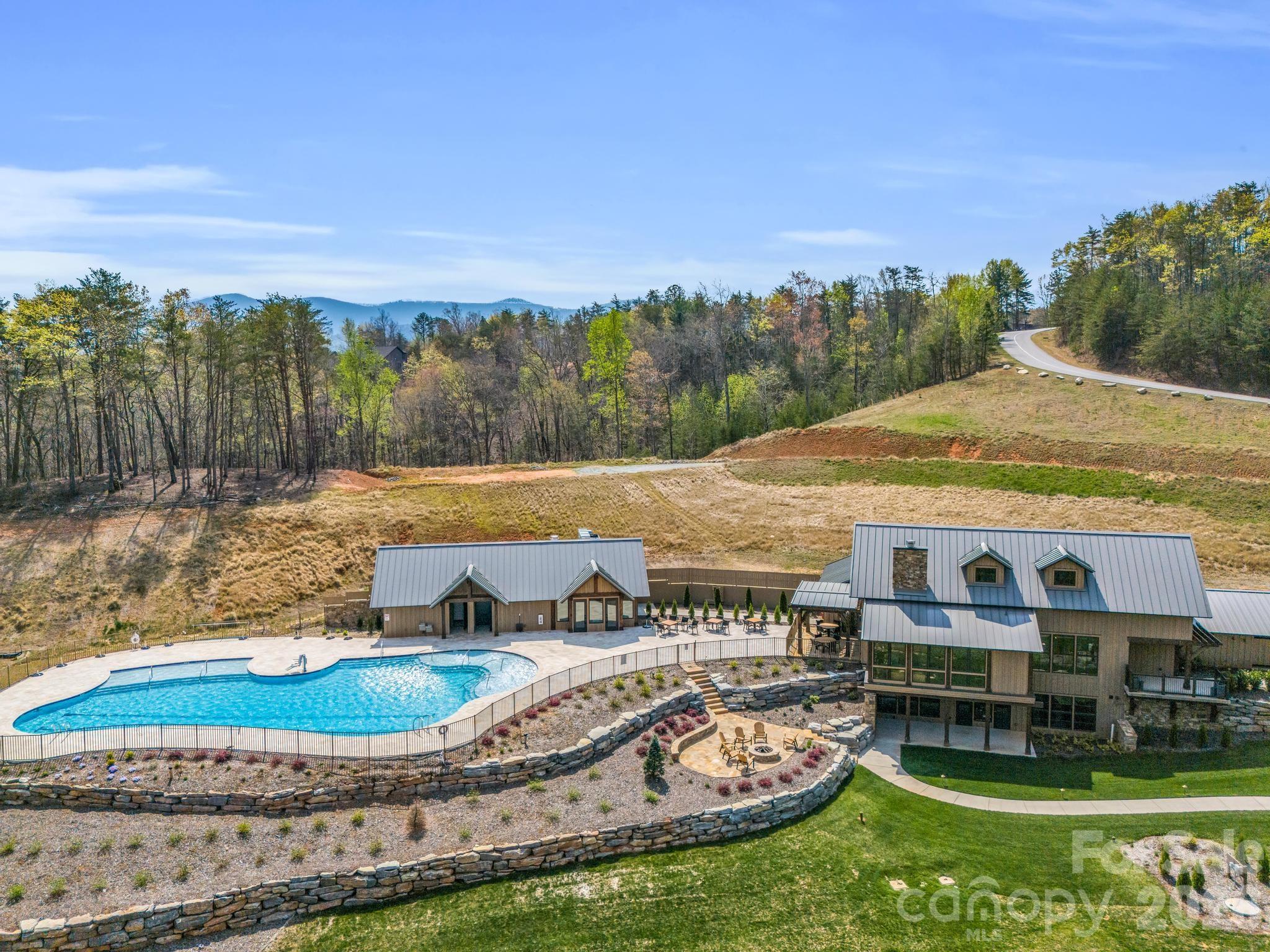 0 Chestertown Drive Mill Spring, NC 28756 - Photo 25 of 35 a view of a swimming pool with an outdoor seating