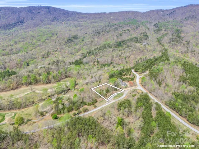 a view of a field with an ocean